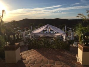 hummingbird nest ranch tent with draping and lighting chiavari chairs white dance floor
