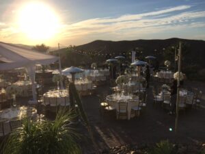 hummingbird nest ranch tent with draping and lighting chiavari chairs white dance floor