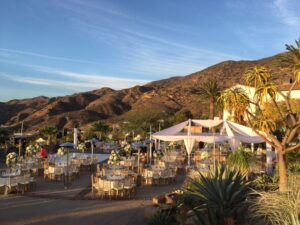 hummingbird nest ranch tent with draping and lighting chiavari chairs white dance floor
